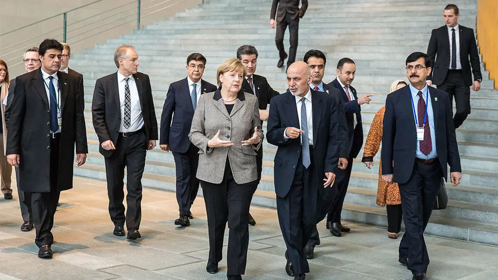 Chancellor Angela Merkel receives Afghanistan's President Mohammad Ashraf Ghani.