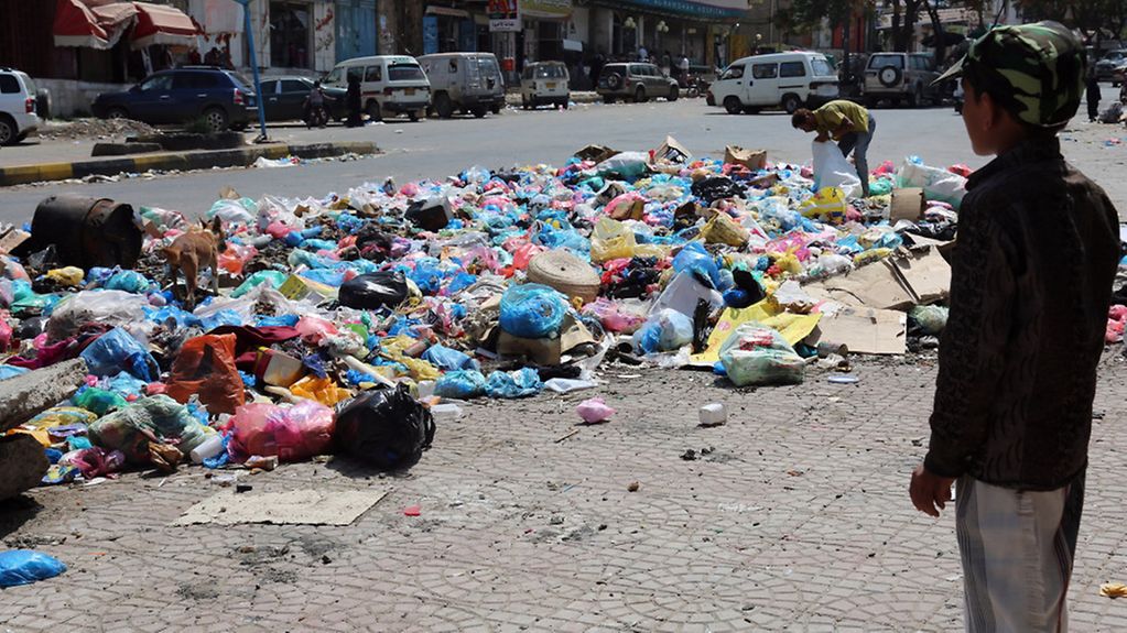 Waste litters a road