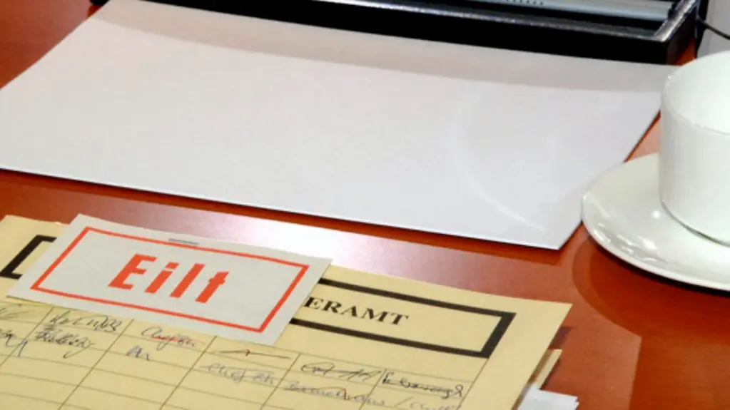 Place at the Cabinet table (with documents)
