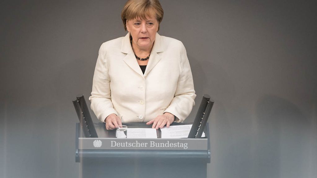 Chancellor Angela Merkel giving her policy statement in the German Bundestag on the upcoming NATO Summit