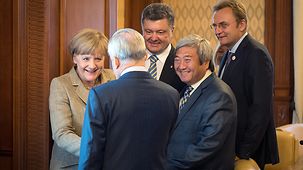 ChancellorAngela Merkel meets mayors of several Ukrainian towns and cities.