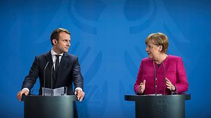 Chancellor Angela Merkel and French President Emmanuel Macron at a joint press conference at the Federal Chancellery
