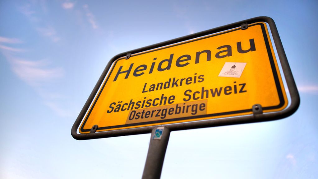 A signs marks the entrance to the town of Heidenau in Saxony