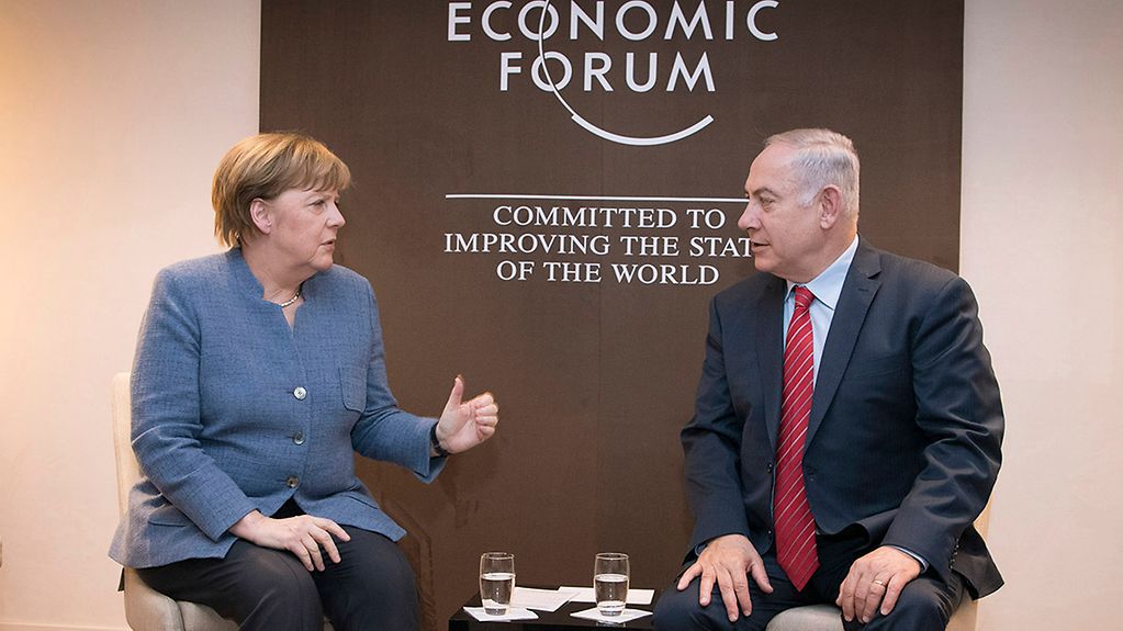 Chancellor Angela Merkel meets with Israeli Prime Minister Benjamin Netanyahu at the World Economic Forum in Davos.