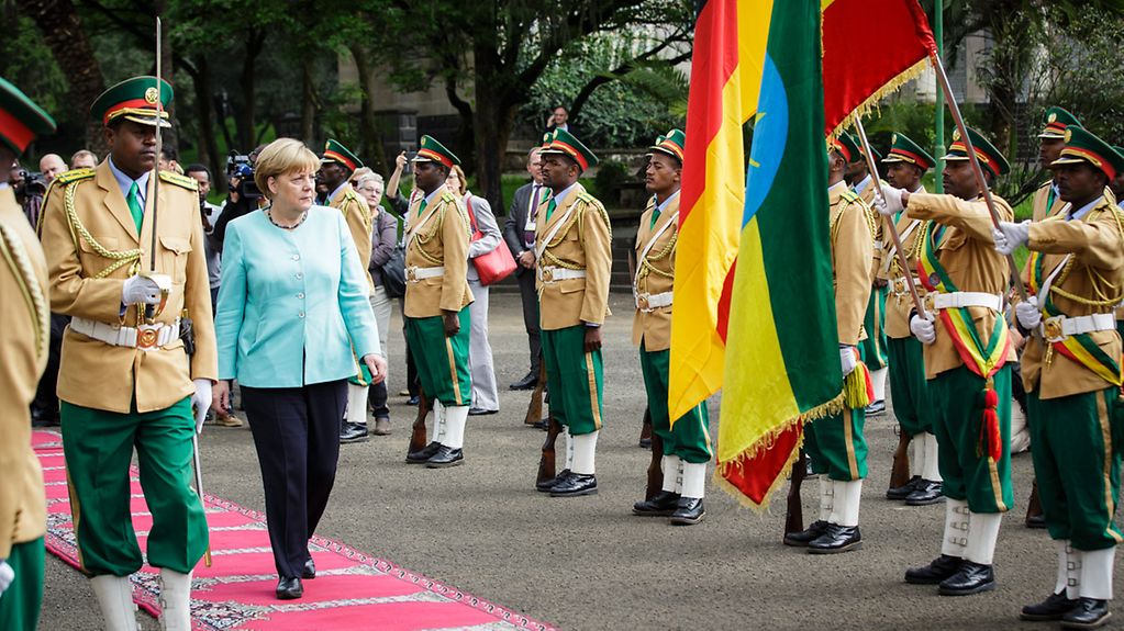Chancellor Angela Merkel is welcomed with military honours in Addis Ababa.