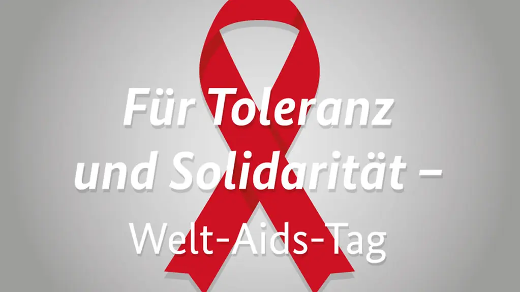 Rote AIDS-Schleife und Text "Für Toleranz und Solidarität - Welt-AIDS-Tag"