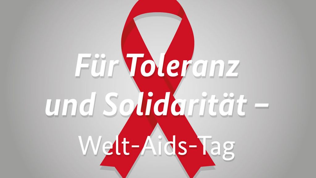 Rote AIDS-Schleife und Text "Für Toleranz und Solidarität - Welt-AIDS-Tag"
