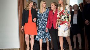 During the Woman20 Summit Chancellor Angela Merkel walks alongside Stephanie Bschorr, Ivanka Trump and Queen Máxima of the Netherlands.