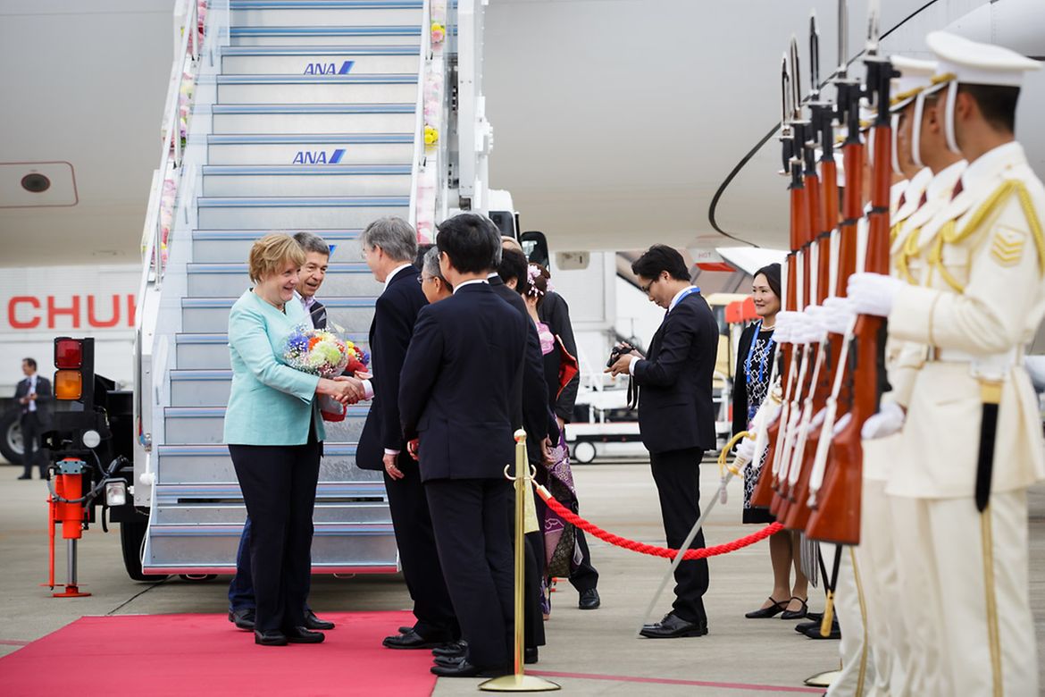 Chancellor Angela Merkel and her husband Joachim Sauer on their arrival at Chubu Centrair International Airport Nagoya