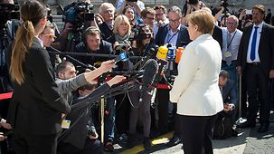Chancellor Angela Merkel delivers a statement to the press.