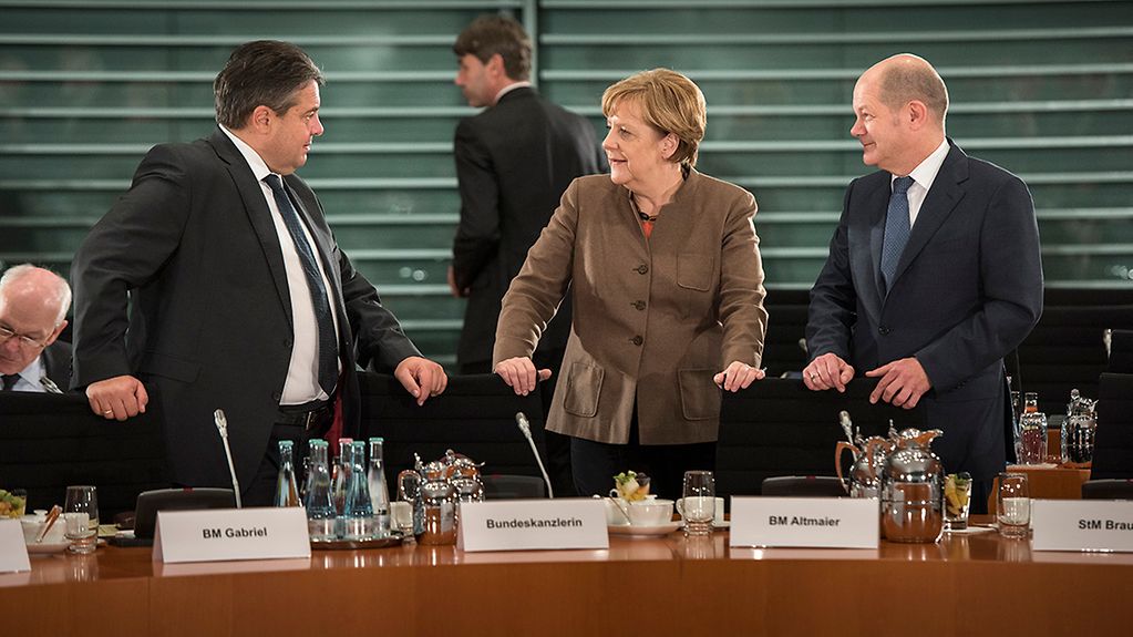 Federal Minister for Economic Affairs Sigmar Gabriel, Chancellor Angela Merkel and the First Mayor of Hamburg, Olaf Scholz