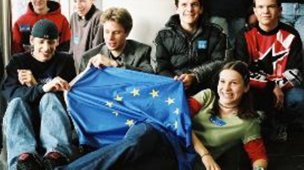 Young people with an EU flag