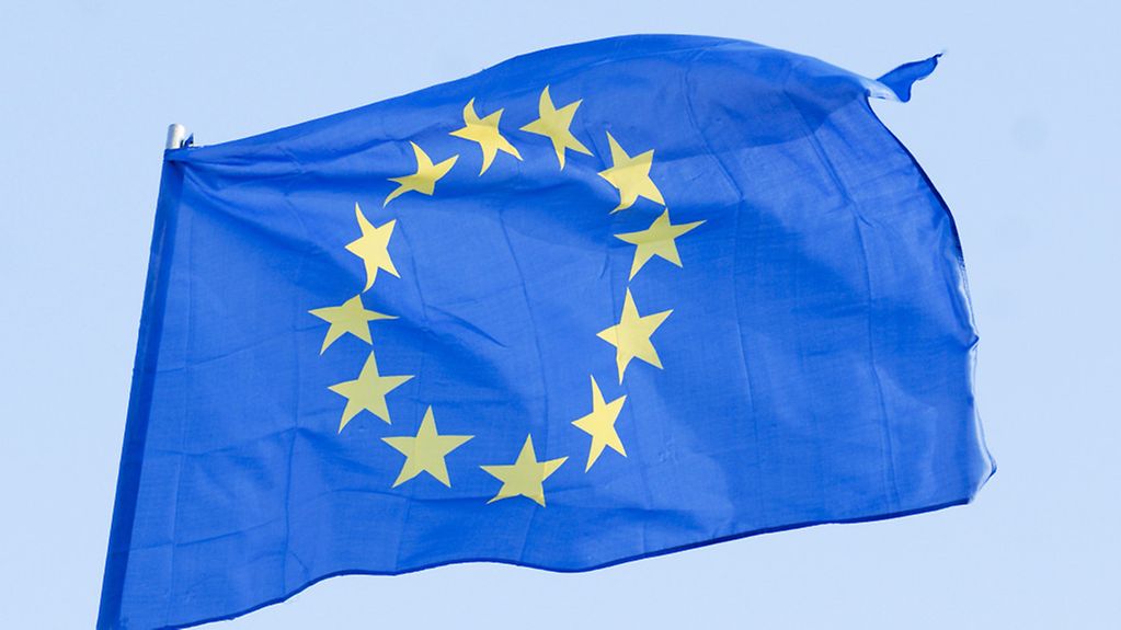 EU flag flying against a blue sky