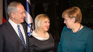 Israeli Prime Minister Benjamin Netanyahu and his wife Sara welcome the Chancellor.