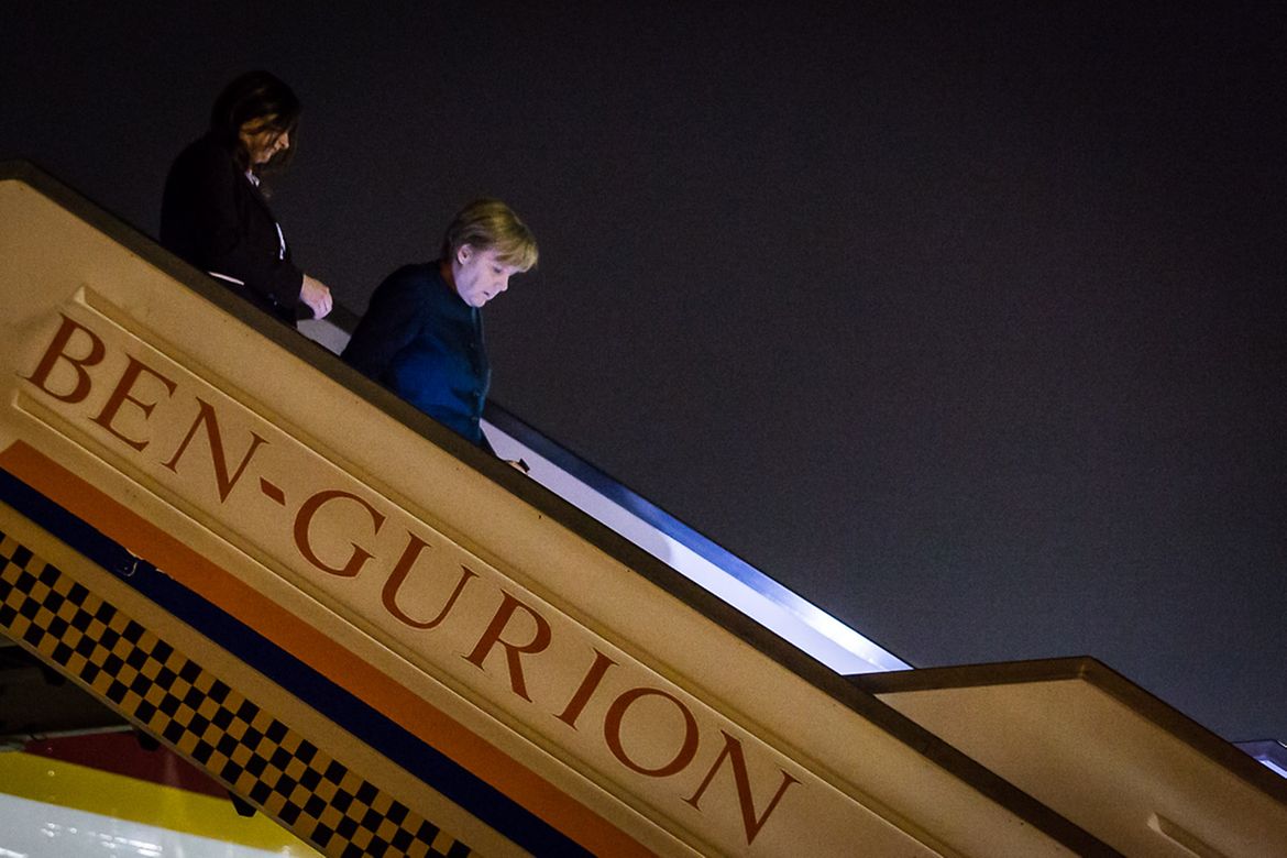 Chancellor Angela Merkel alights from the government aircraft at Ben Gurion Airport in Tel Aviv.
