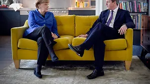 Chancellor Angela Merkel and British Prime Minister David Cameron talk.