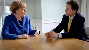 Chancellor Angela Merkel talks to Nick Clegg.