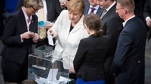 Chancellor Angela Merkel casts her vote in the German Bundestag to elect the Chancellor.